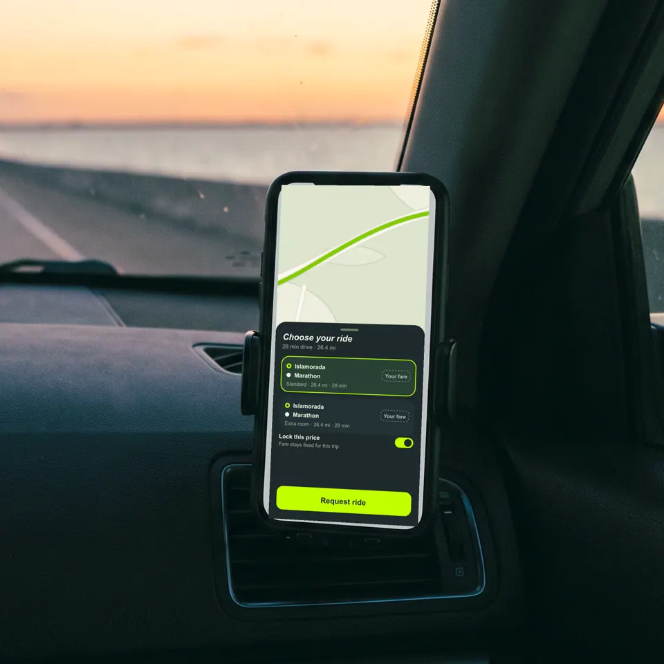 A close view of a phone showing a live trip on the Outride map