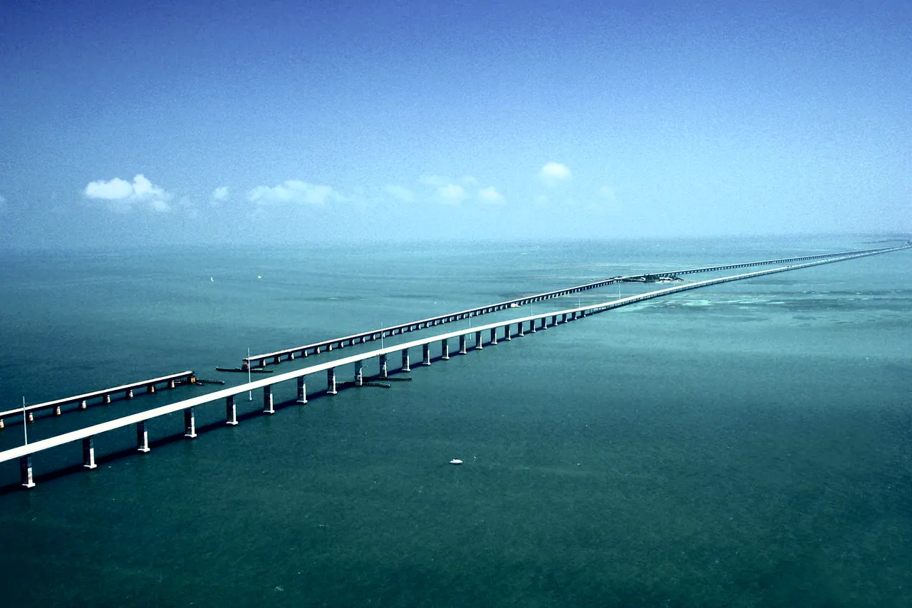 The Seven Mile Bridge from the air, running out across turquoise water to the horizon.